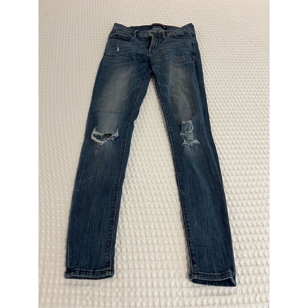 Express jeans mid rise legging skinny blue jeans with holes size 4